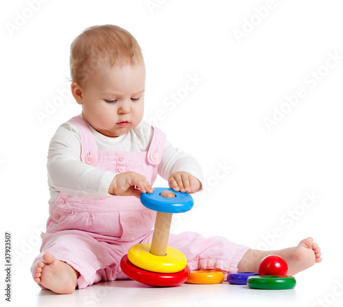 baby playing with color toy