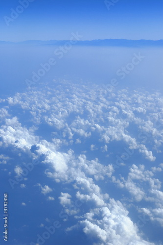Fototapeta Naklejka Na Ścianę i Meble -  blue sky clouds view from aircraft airplane sunny day
