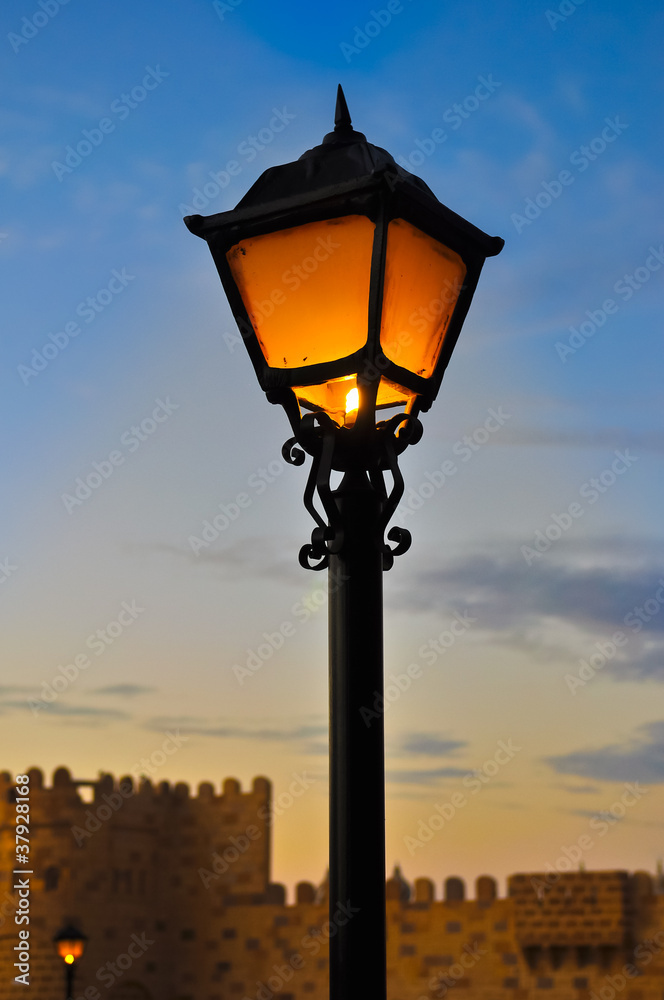 Street lamp on blue dusk sky background