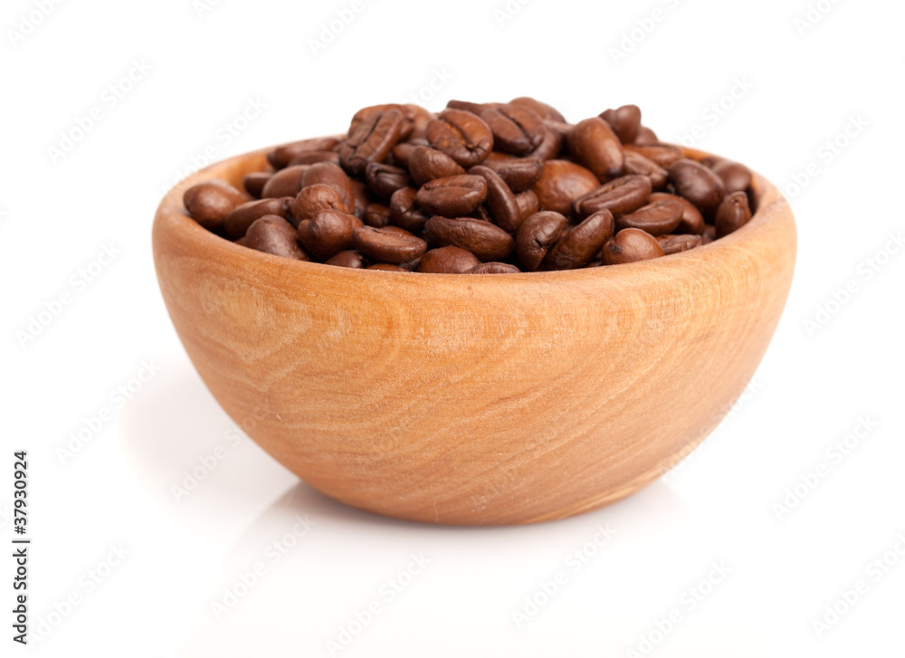 coffee beans in the wooden bowl. coffee beans in the wooden bowl.