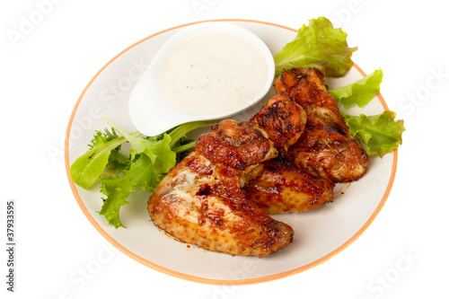 Grilled chicken wings isolated on white