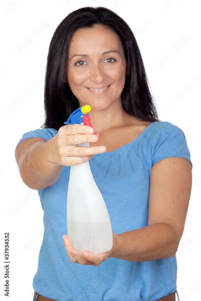 Adorable housewife with diffuser making cleaning (with focus on Adorable housewife with diffuser making cleaning (with focus on