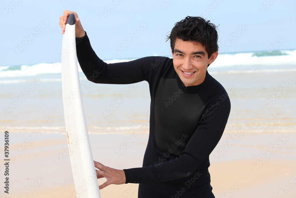 Teenager with surfboard