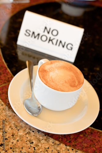 cup of cappuccino on no-smoking table