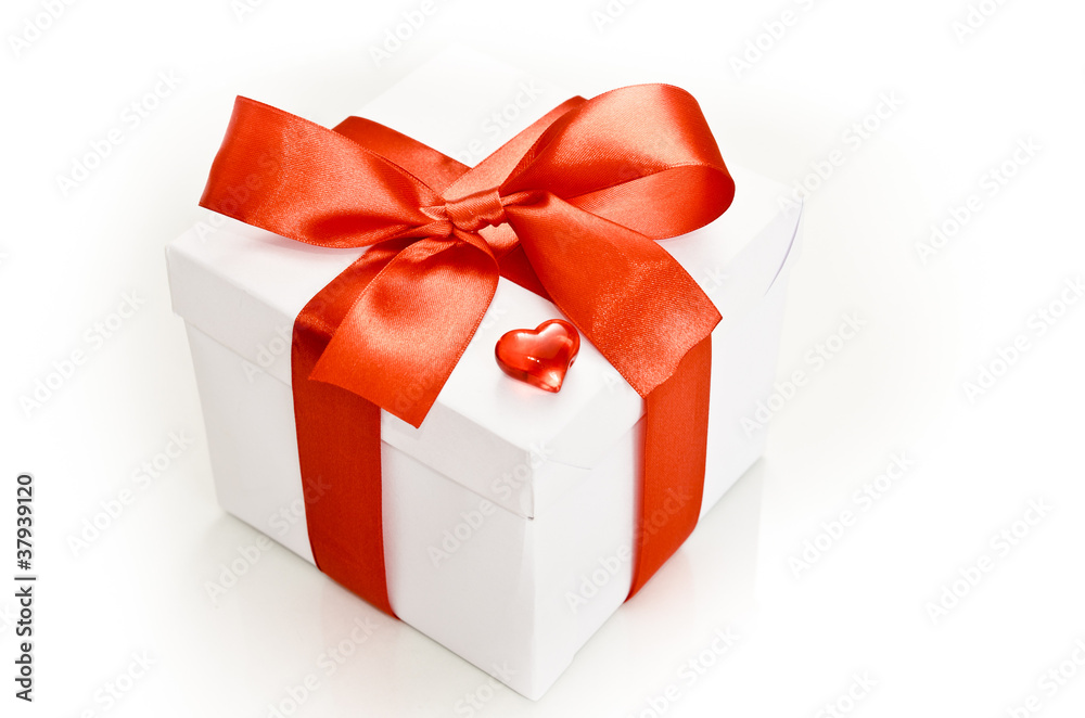 white gift box with red ribbon white gift box with red ribbon