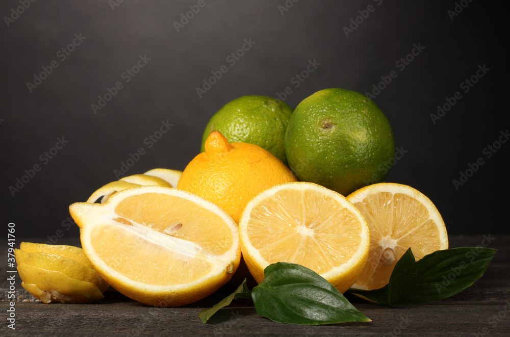 ripe lemons and limes with leaves ripe lemons and limes with leaves