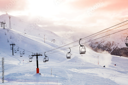 Winter mountains panorama with ski slopes and lifts © Dinga