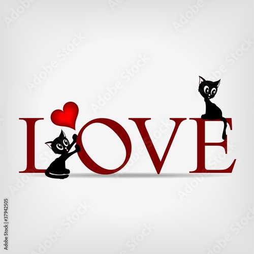 word "LOVE" with two black kittens