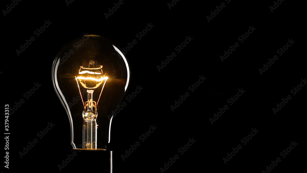 Light bulb over black background