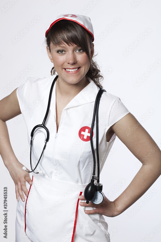 smiling young nurse in her white coat smiling young nurse in her white coat