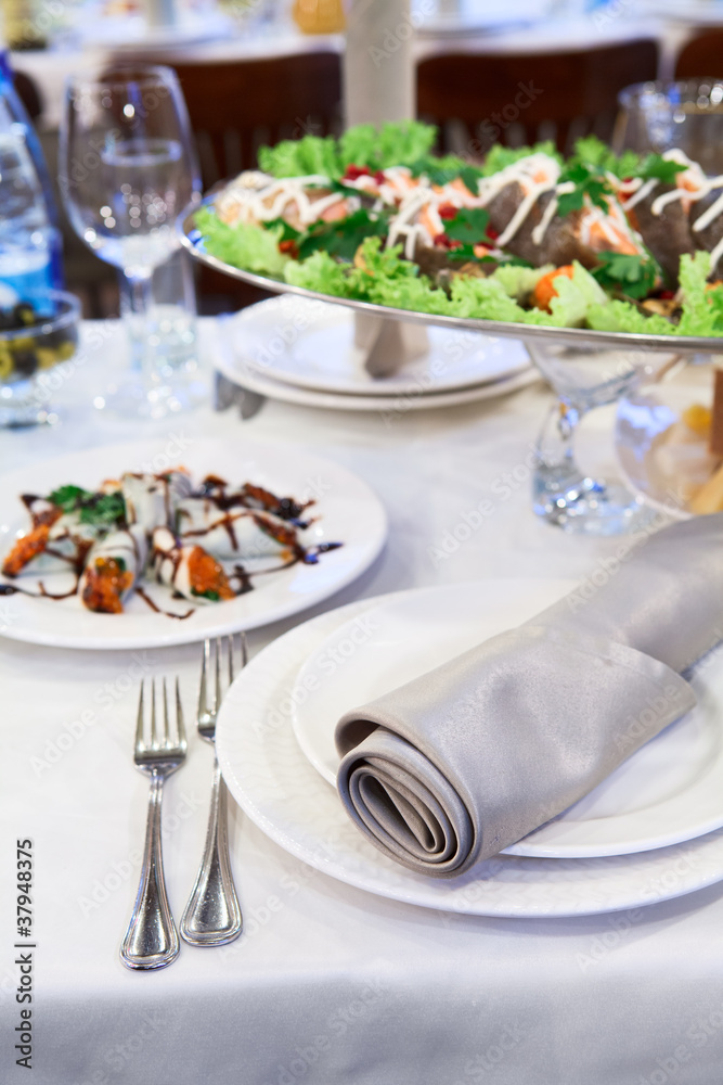 Fototapeta premium Grilled salmon fish in a dish on the dinner table
