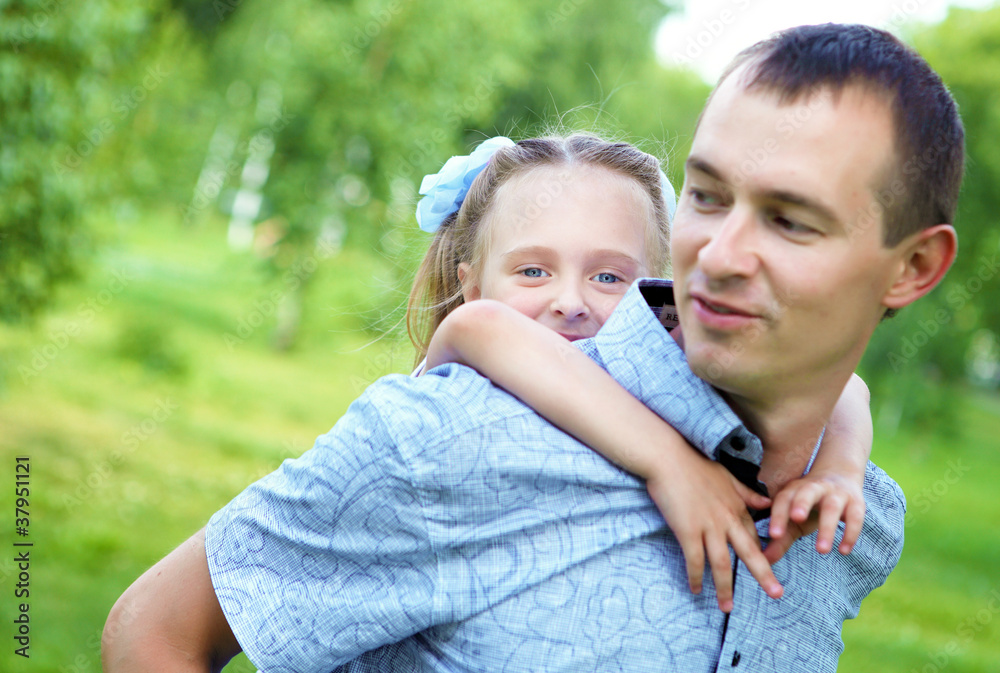 father and daughter in the summer park father and daughter in the summer park
