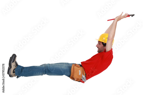 Tradesman jumping in the air