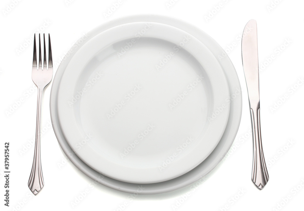 White empty plate with fork and knife isolated on white White empty plate with fork and knife isolated on white