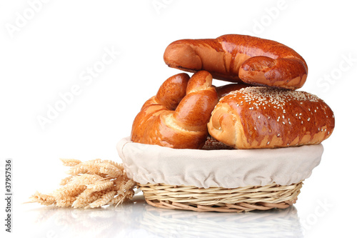 Baked bread in basket isolated on white