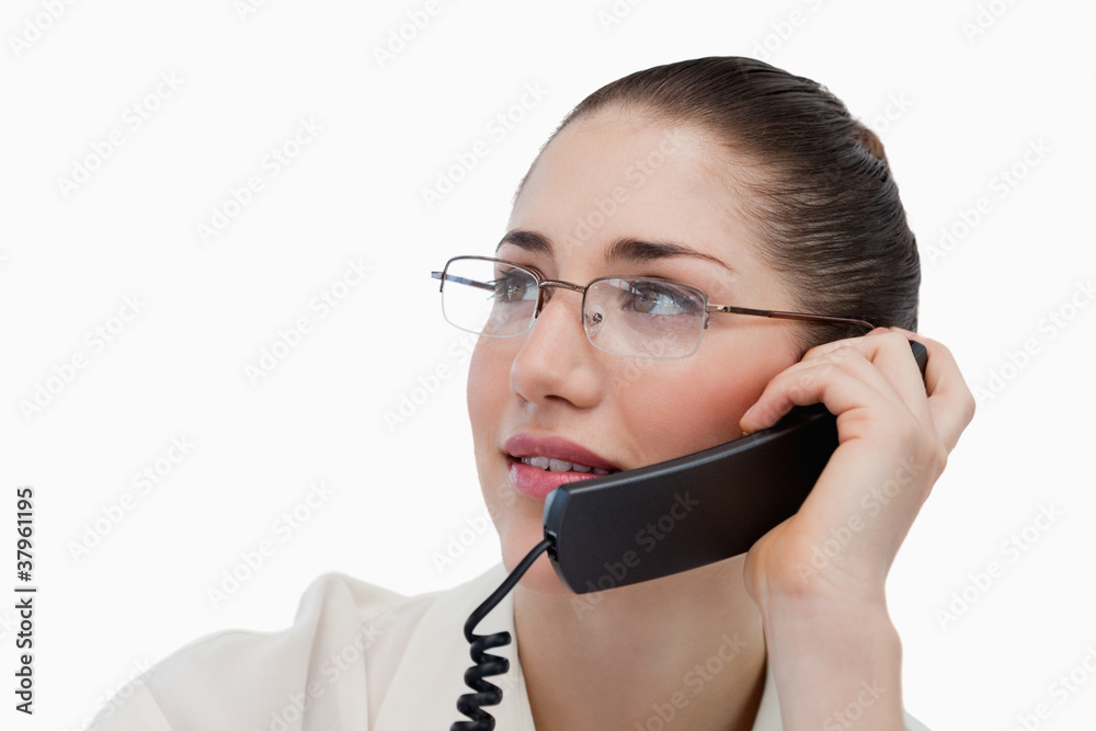 Close up of a secretary making a phone call Close up of a secretary making a phone call