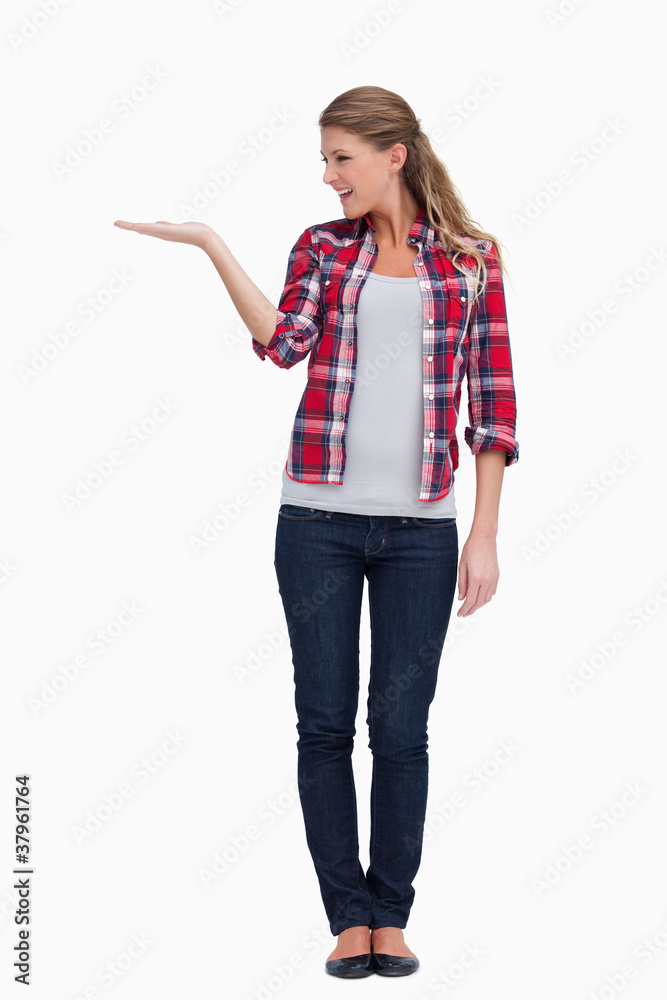 Portrait of a smiling woman displaying a copy space Portrait of a smiling woman displaying a copy space