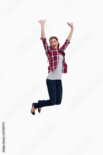 Portrait of a cheerful woman jumping