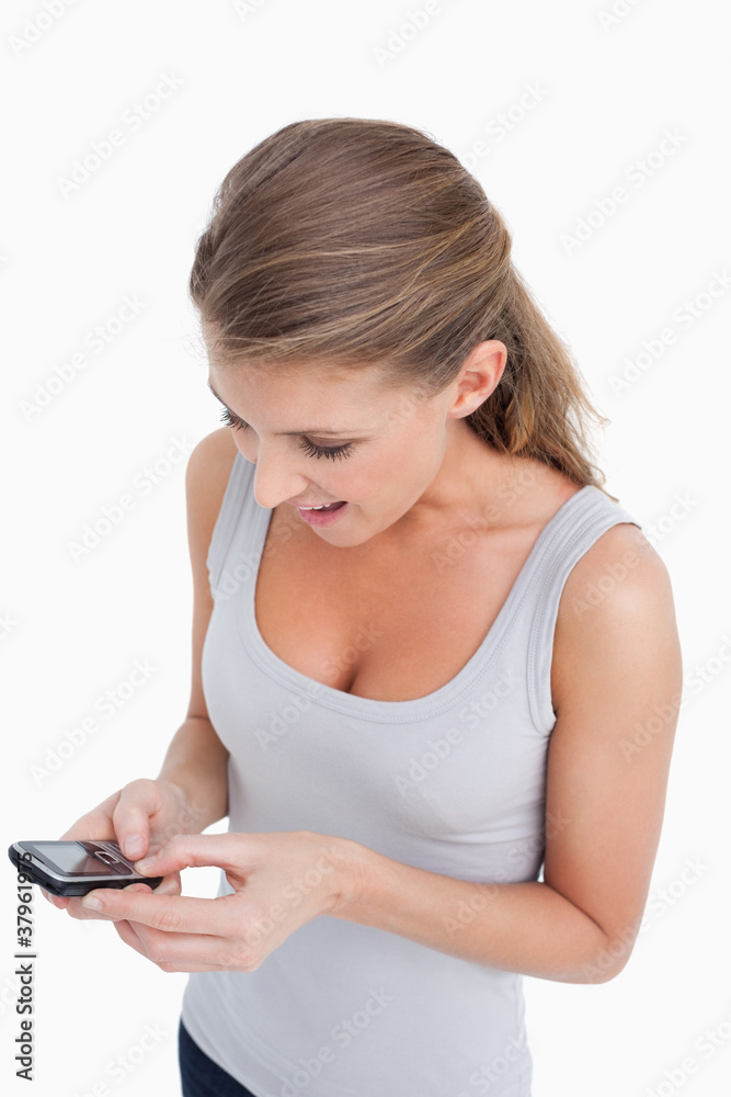Portrait of a woman reading a text message Portrait of a woman reading a text message