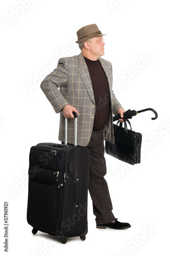 Man in a checkered suit and luggage