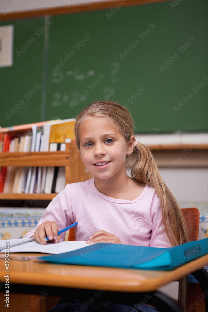 Portrait of a cute schoolgirl writing Portrait of a cute schoolgirl writing
