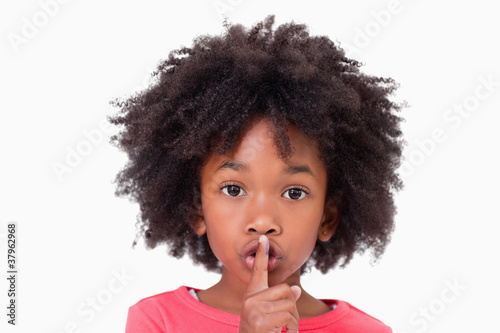 Close up of a girl asking silence photo