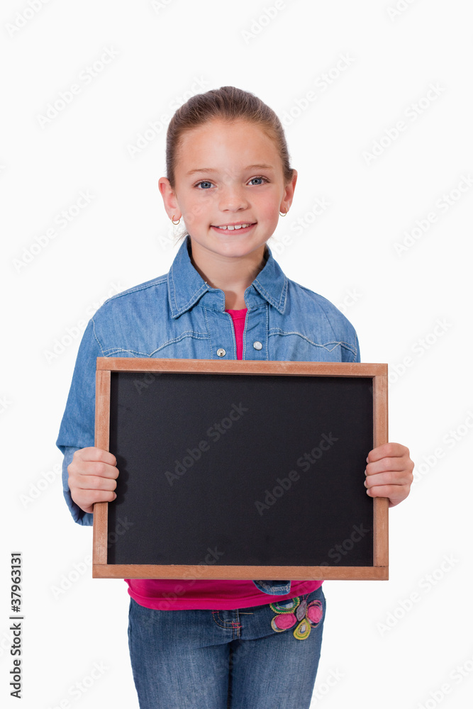 Portrait of a young girl holding a school slate Portrait of a young girl holding a school slate