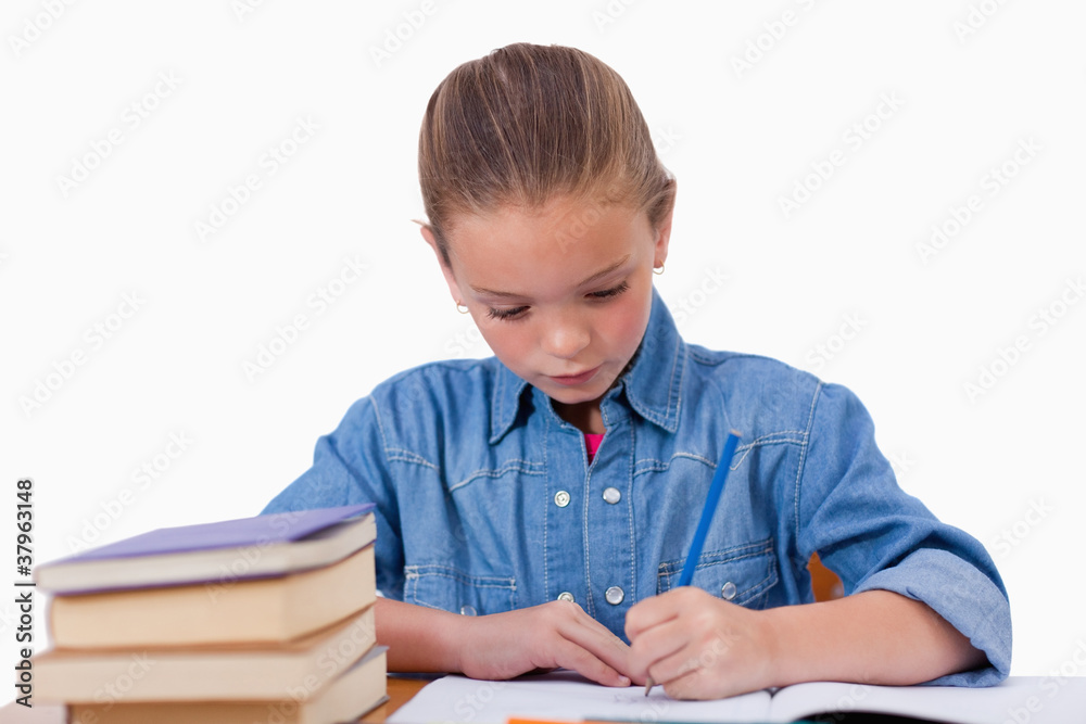 Serious girl writing on a notebook Serious girl writing on a notebook
