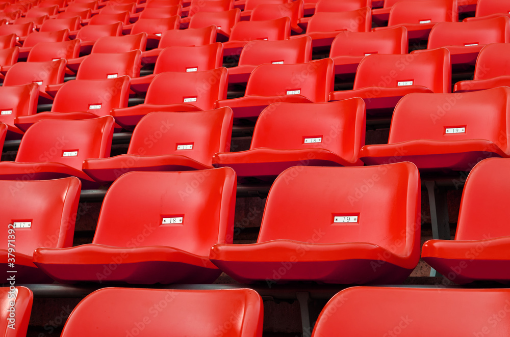 Fototapeta premium Red Empty plastic seats at stadium