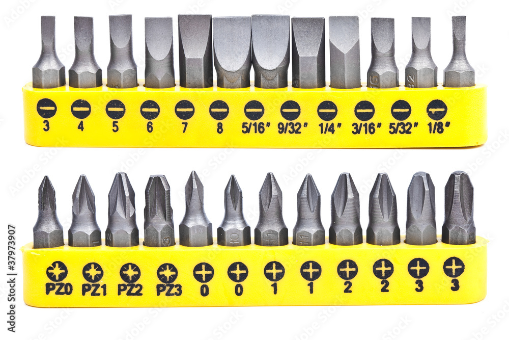 Set of screwdriver heads in a yellow container isolated on white Set of screwdriver heads in a yellow container isolated on white