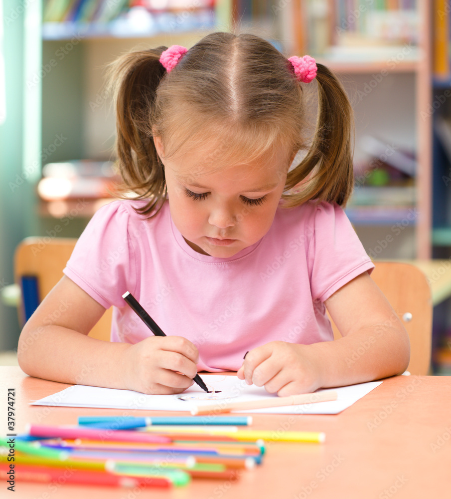 Little girl is drawing with felt-tip pen Little girl is drawing with felt-tip pen