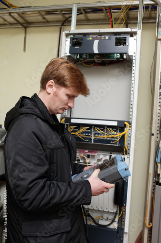Engineer holding reflectometer