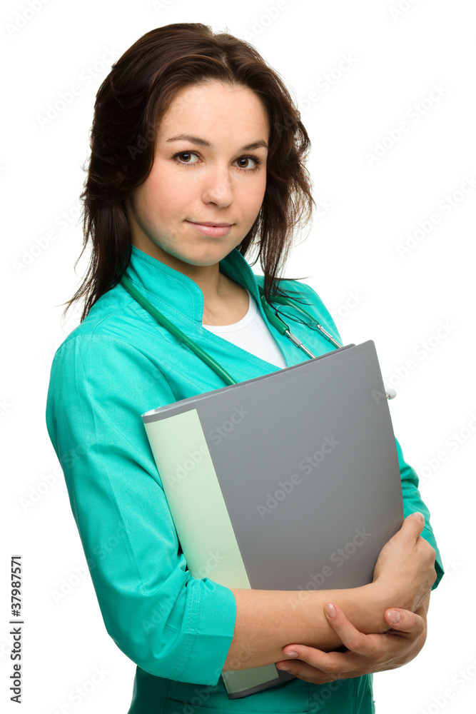 Young attractive woman wearing a doctor uniform Young attractive woman wearing a doctor uniform
