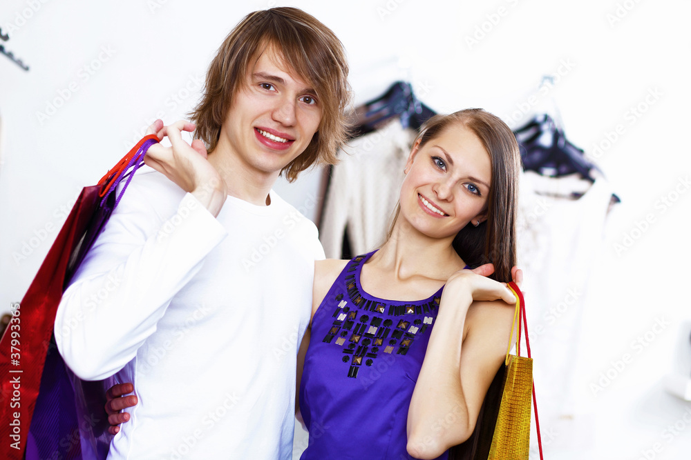 Young couple doing shopping together Young couple doing shopping together