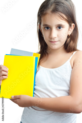 Hispanic girl holding some colorful textbooks isolated on white