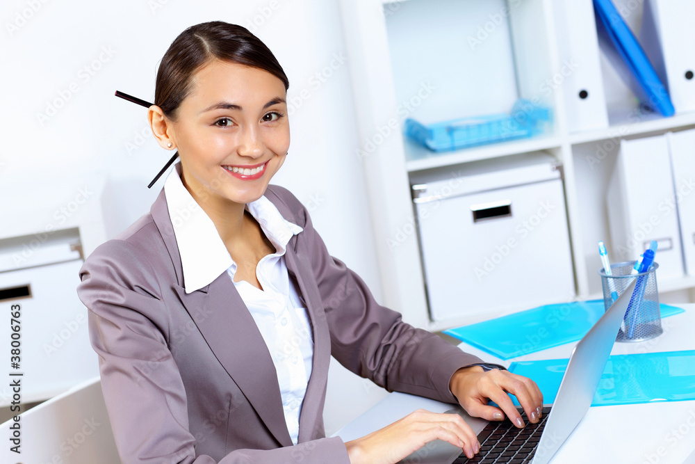 Young woman in business wear working in office Young woman in business wear working in office