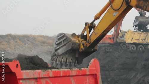 Excavator loading truck.