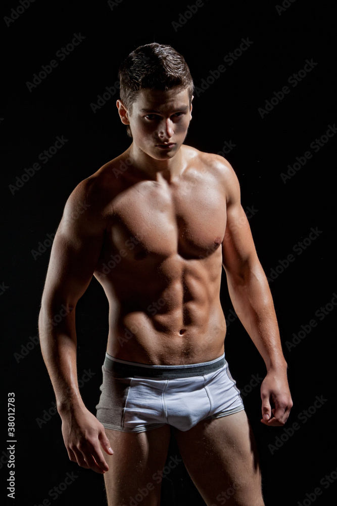 Muscular young naked sexy boy posing in underwear Stock Photo | Adobe Stock