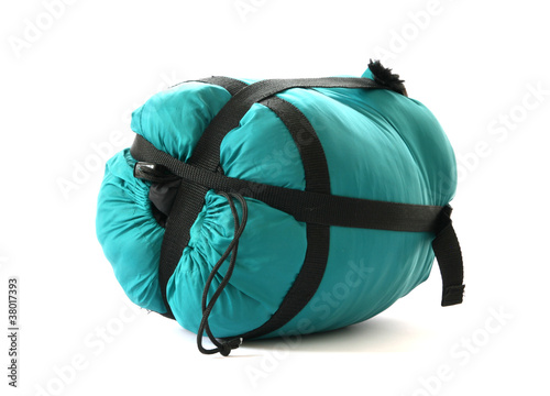 Packed sleeping-bag on white background