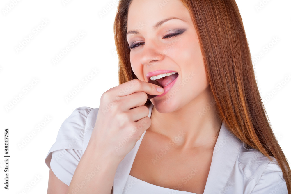 Beautiful young woman eating chocolates Beautiful young woman eating chocolates