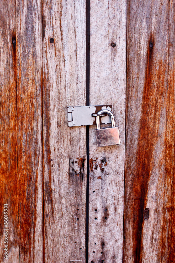 padlock on the old wooden wall padlock on the old wooden wall