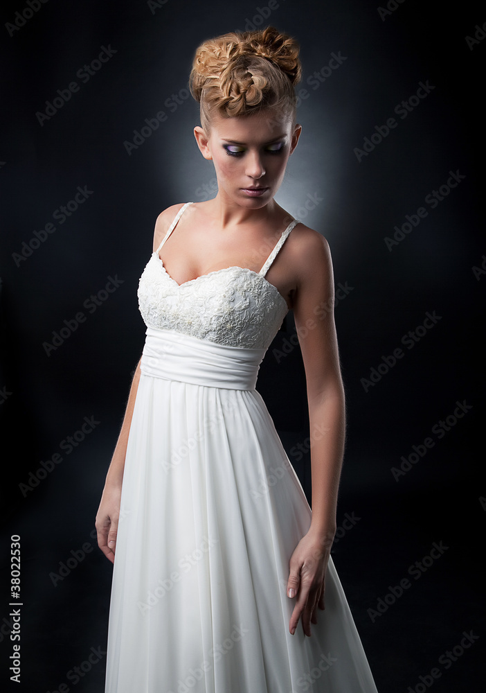 Gentle bride lovely young girl in wedding dress posing Gentle bride lovely young girl in wedding dress posing