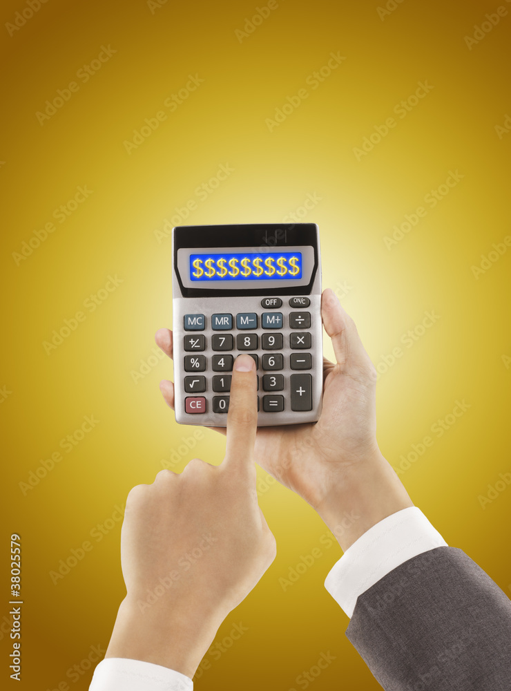 businessman pressing calculator ,golden background businessman pressing calculator ,golden background