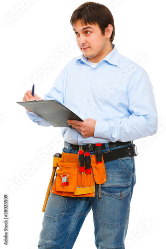 Worker checking something and writing in clipboard © Alliance