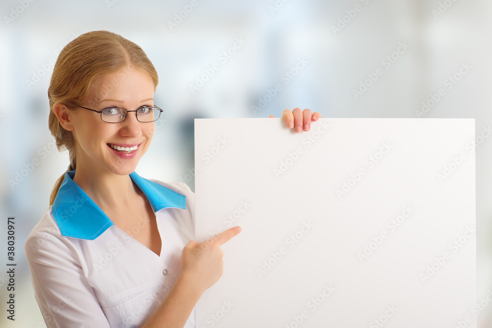 beautiful young nurse holding a blank billboard beautiful young nurse holding a blank billboard