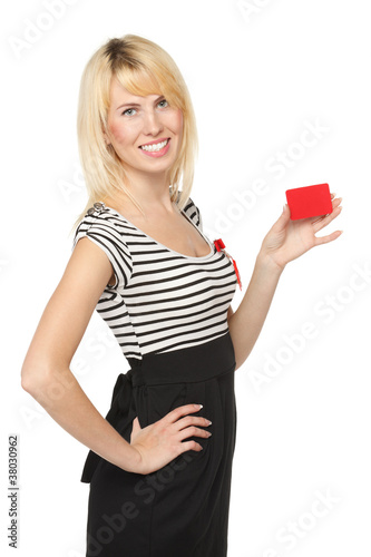 Young smiling female holding a blank credit card