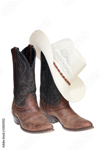 Cowboy boots and hat isolated over white with clipping path