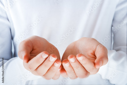 cupped empty hands in the act of presenting something