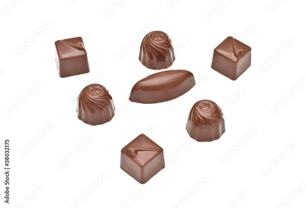 Chocolate pralines on white background