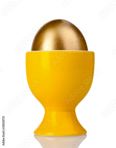 egg in yellow stand isolated on white